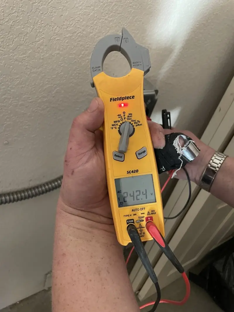 Voltage testing with clamp meter during Ceiling Fan Installation in Flossmoor